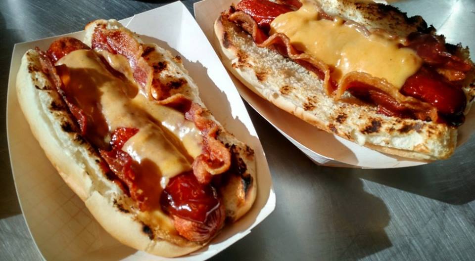 Bonehead's BBQ THE RIPPER DOG A deep fried jumbo hot dog topped with crispy bacon, cheddar cheese and BBQ sauce